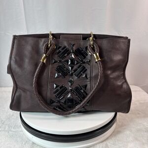 IMAN GLOBAL CHIC Brown Leather Handbag With Braided Handles And Black Gemstones